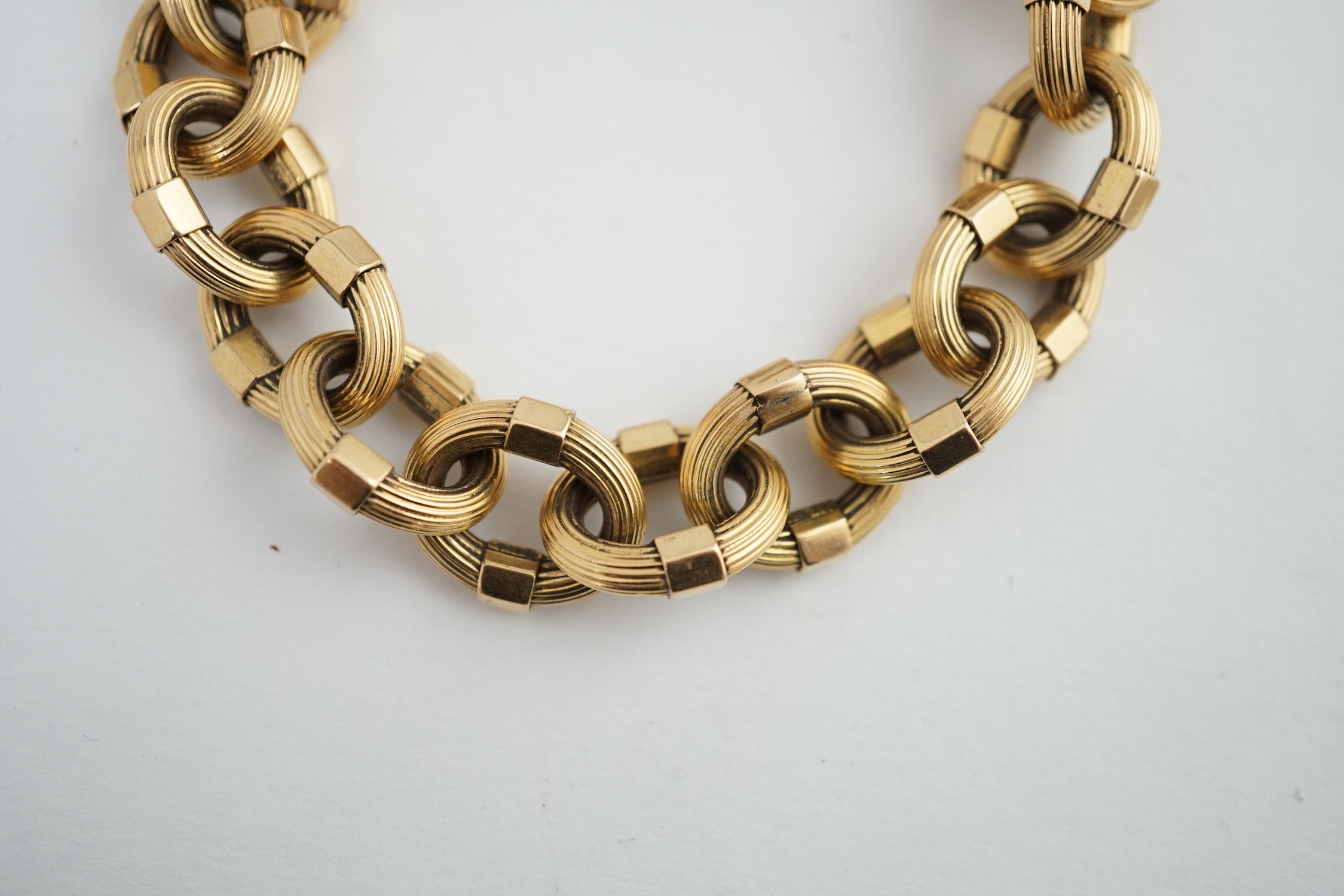 A late 20th century Italian 18k gold reeded oval link bracelet